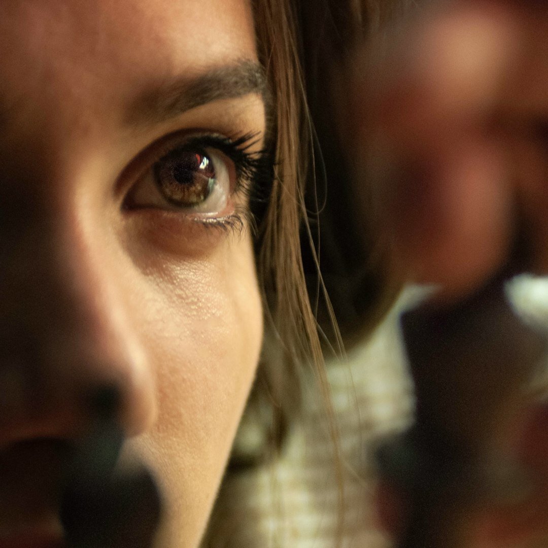 Portrait of an Australian-Indian female vision switcher operator in a broadcast studio