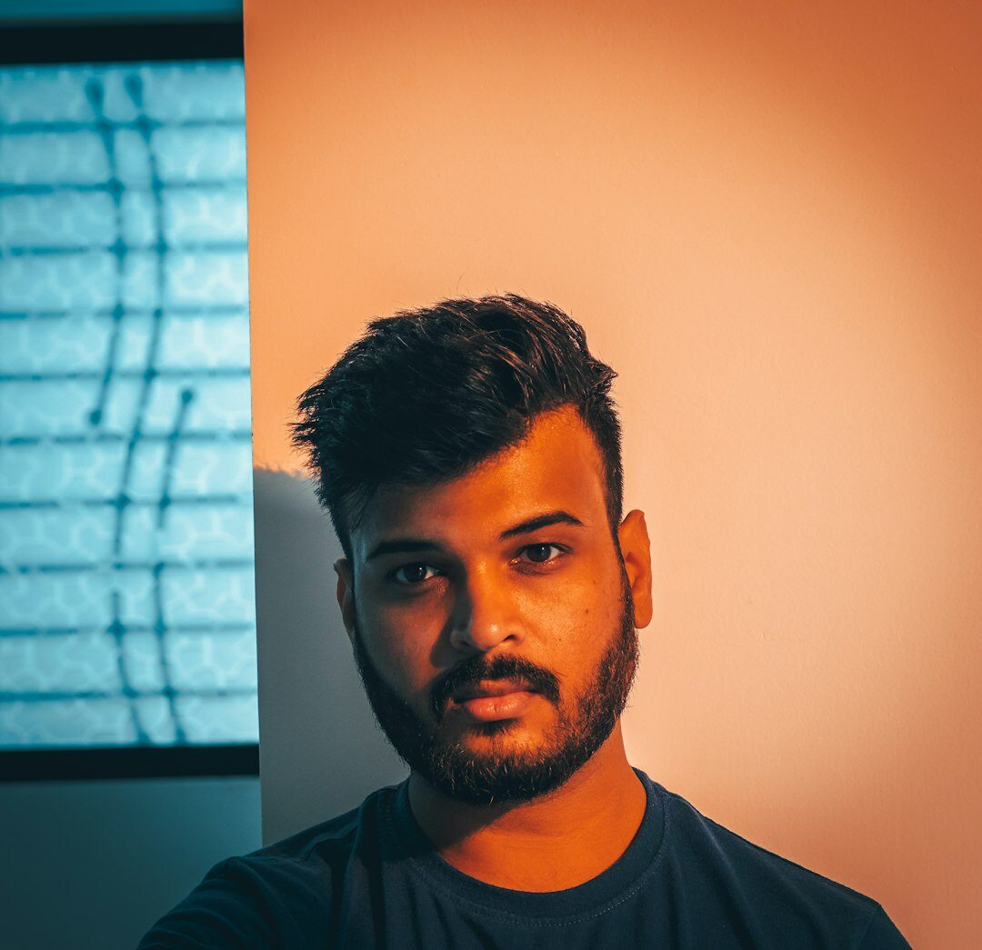 Portrait of an Australian male broadcast director standing in a television control room