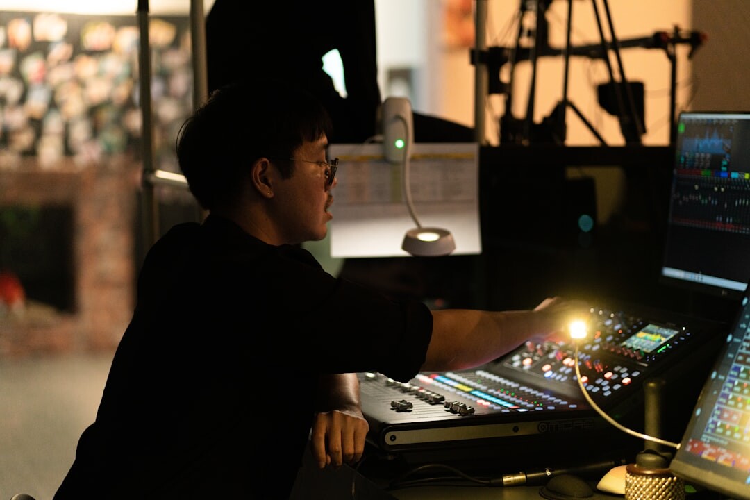Television producer wearing a headset directing crew from inside a live control room