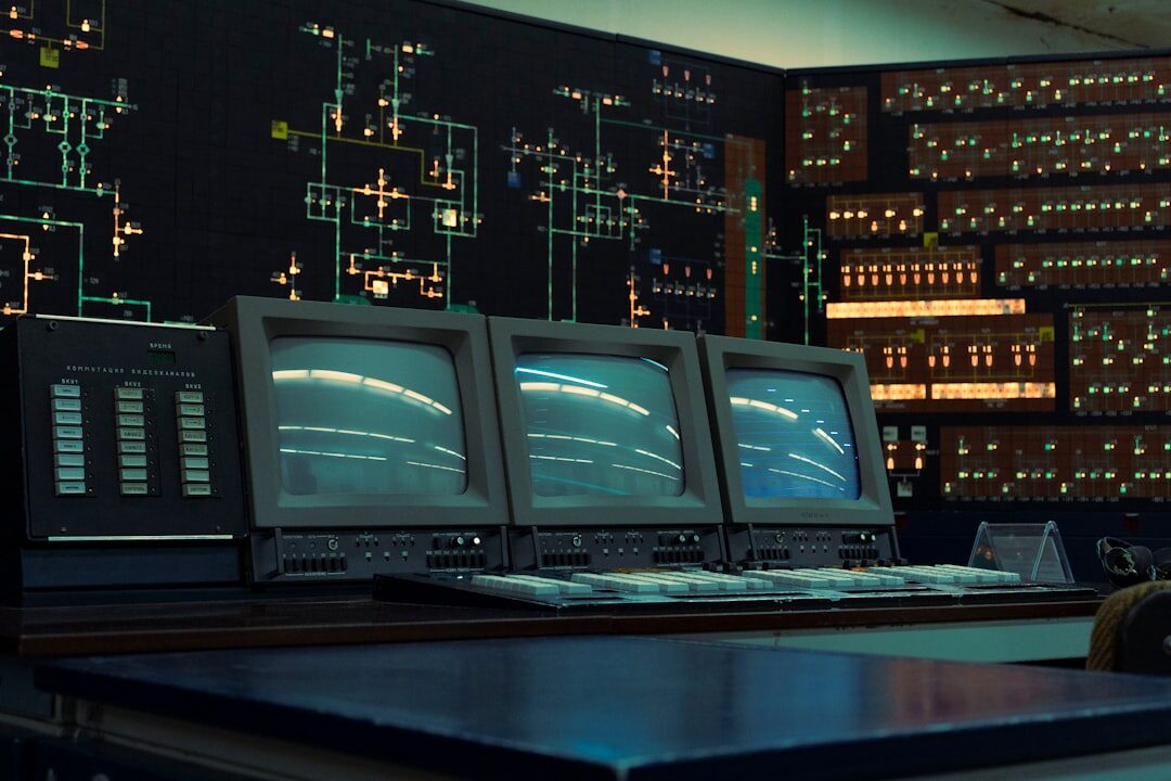 Television control room with multiple broadcast monitors and a live vision mixing console